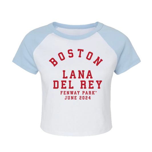 Front view of the Lana Del Rey Fenway Park Baby Raglan Tee featuring a white fitted baby raglan T-shirt with light blue sleeves and a red Boston Lana Del Rey Fenway Park June 2024 graphic, inspired by the exclusive Boston Fenway Park tour merchandise collection.