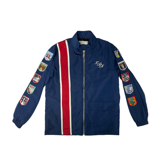 Front view of the Lana Del Rey Navy Album Patch Racing Jacket featuring embroidered LDR monogram, red and white racing stripes, and collectible album-inspired patches on both sleeves with a full-zip vintage motorsport design.
