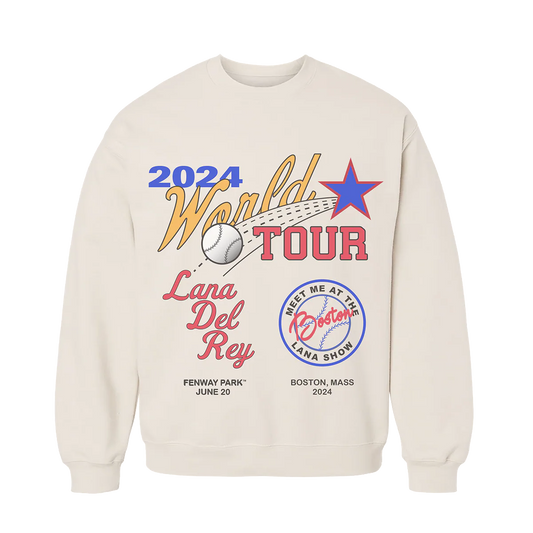 Front view of the Lana Del Rey World Tour Crewneck Sweatshirt in cream featuring colorful 2024 World Tour baseball-inspired graphics, Boston Fenway Park June 20 concert artwork, and official Lana Del Rey tour merchandise design.