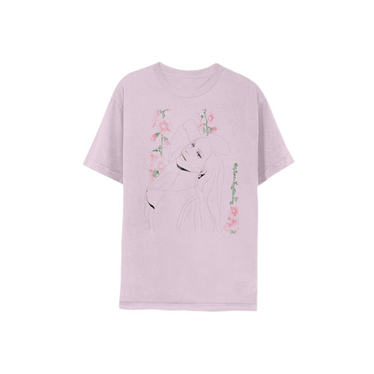 Front view of the Ocean Blvd Lilac Illustration T-Shirt featuring a delicate line-art portrait of Lana Del Rey surrounded by pink floral artwork on a soft lilac cotton tee inspired by the Did You Know That There's a Tunnel Under Ocean Blvd era.