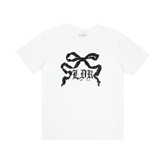 Front view of the Ribbon Graphic White T-Shirt featuring a black ribbon bow illustration with gothic LDR lettering printed on a white cotton tee inspired by Lana Del Rey's vintage romantic aesthetic.