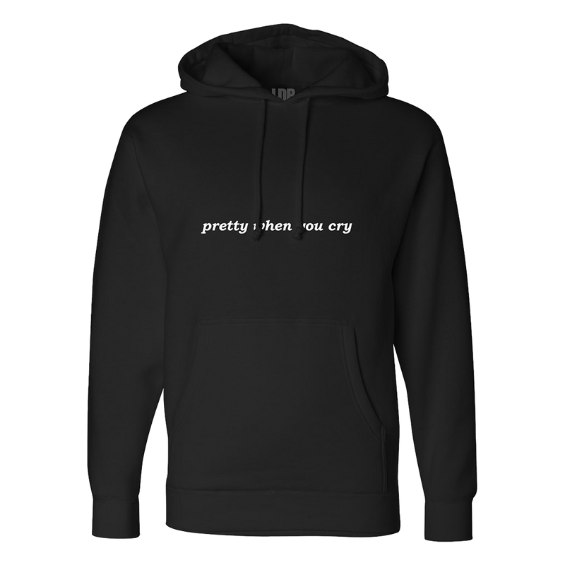 Front view of the Ribbon Print Black Zip-Up Hoodie featuring the phrase "pretty when you cry" printed across the chest on a black hoodie with a kangaroo pocket and adjustable drawstring hood inspired by Lana Del Rey's melancholic aesthetic.