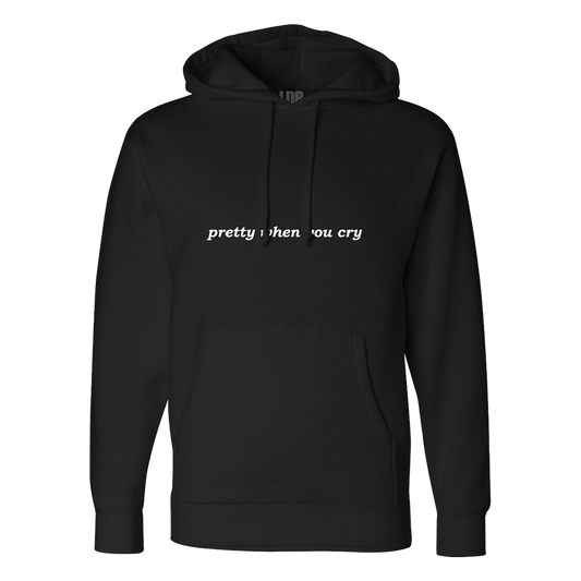 Front view of the Ribbon Print Black Zip-Up Hoodie featuring the phrase "pretty when you cry" printed across the chest on a black hoodie with a kangaroo pocket and adjustable drawstring hood inspired by Lana Del Rey's melancholic aesthetic.
