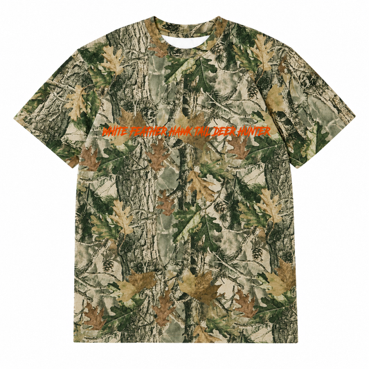 Front view of the White Feather Realtree Camo T-Shirt featuring an all-over Realtree camouflage forest pattern with bold orange "White Feather Hawk Tail Deer Hunter" graphic across the chest, inspired by Lana Del Rey's upcoming Stove album merchandise.